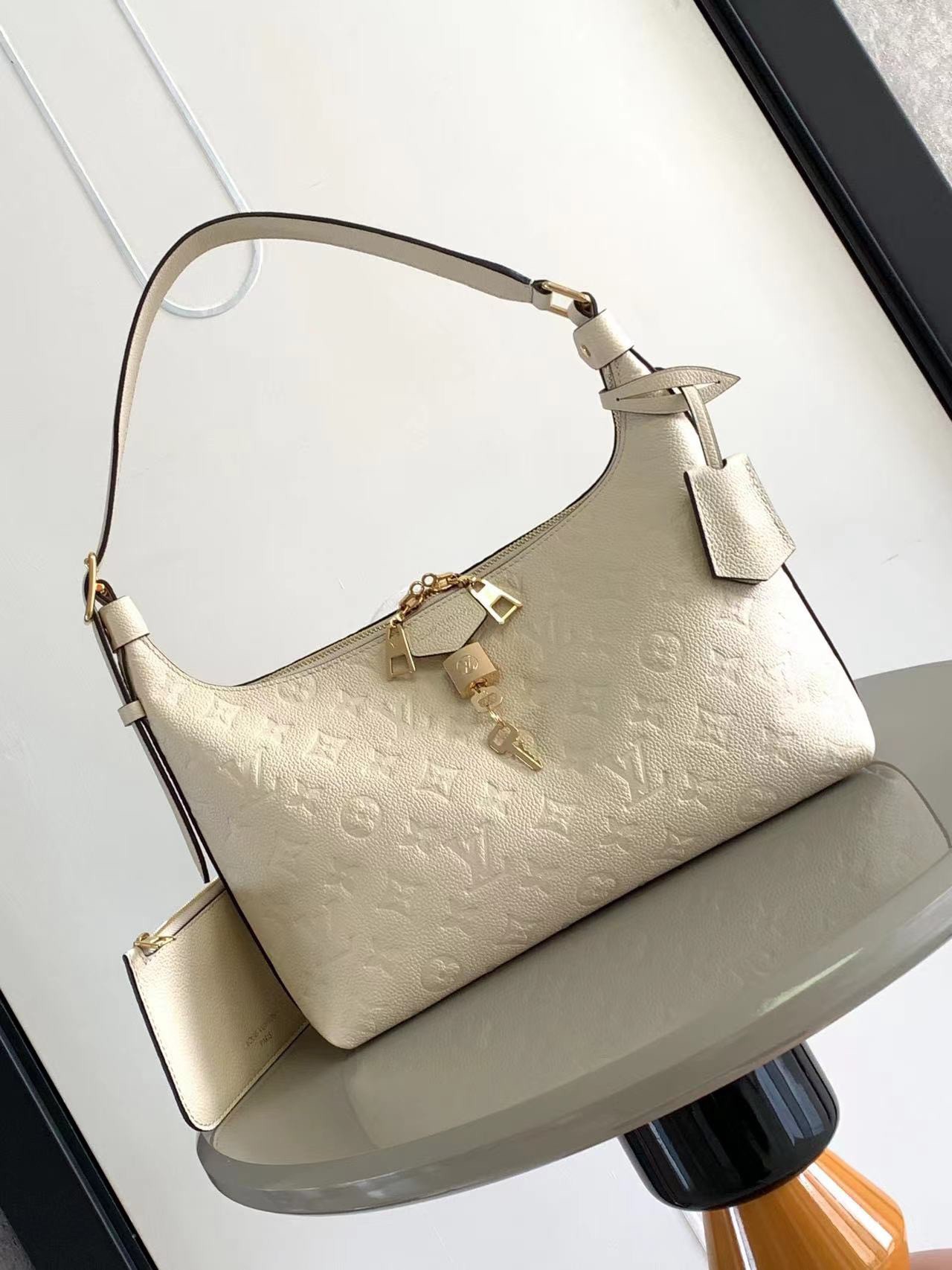 Replica Louis Vuitton Sac Sport Slouchy Bag M46609 Monogram Empreinte Cream  Fake Wholesale